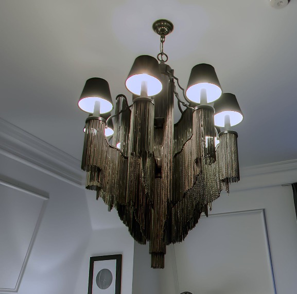 Ornate chandelier with fringe trim